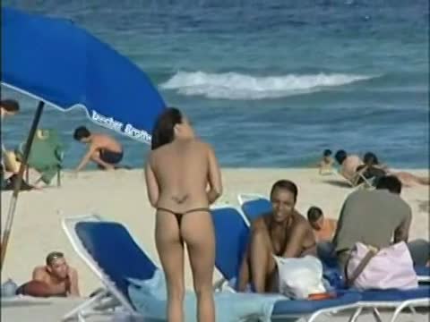 Topless beach voyeur shots of cute girls relaxing themselves