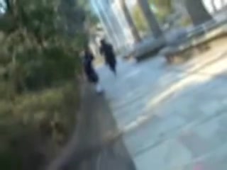 Naughty man sharking Asian college girl skirt in the street