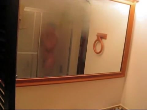 Spy cam is shooting her naked body reflecting in the mirror