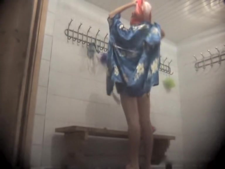 Dressing room video of girl in bath robe after shower