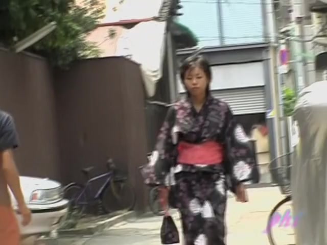 Cute Asian in a jukata has boob sharking on the street.