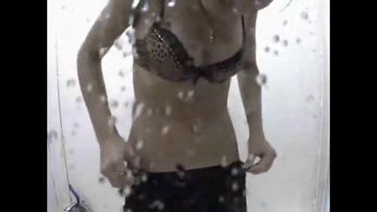Tanned girl in beach shower