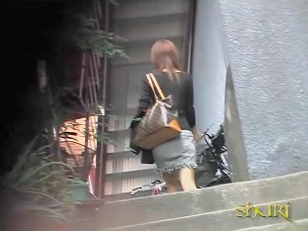 Open-minded pretty babe is walking on the street during fast sharking attack