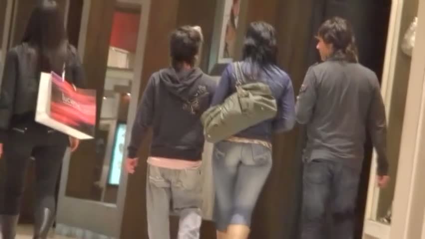 Street candid video features a tight hot ass i blue jeans.