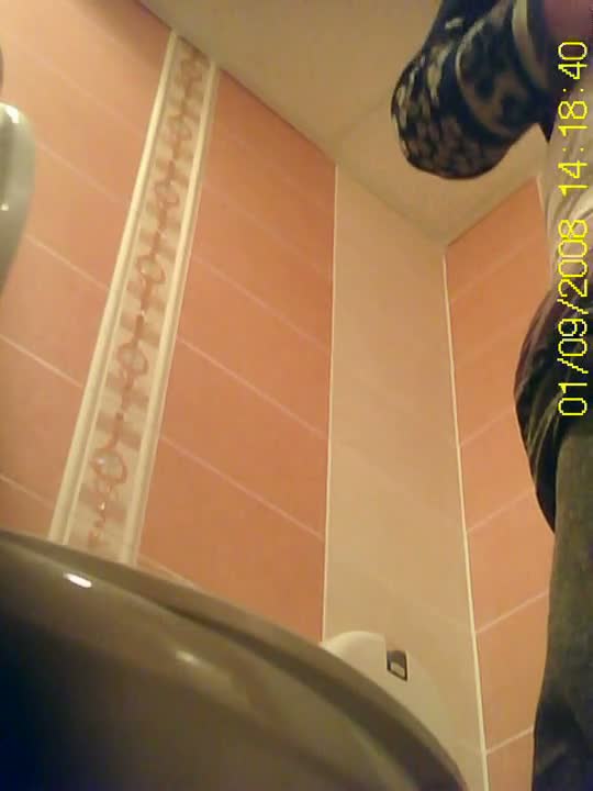 Peeing spy cam catches a mature woman urinating