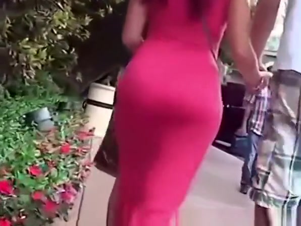 Woman with big round ass in tight dress