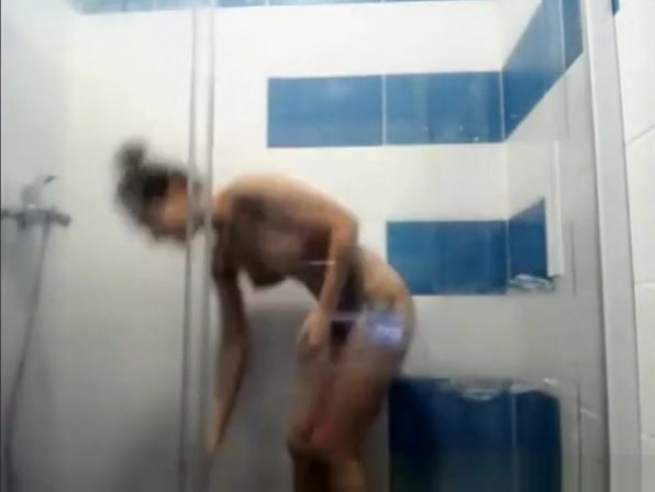 Tattooed chick with nice body taking shower
