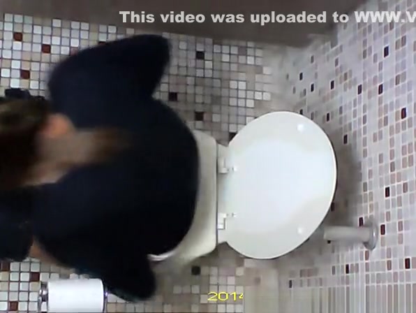 Hidden camera in toilet ceiling catches woman pissing