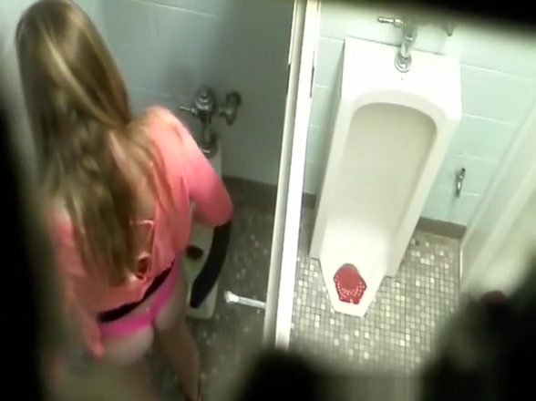 Girl seats in toilet and pees