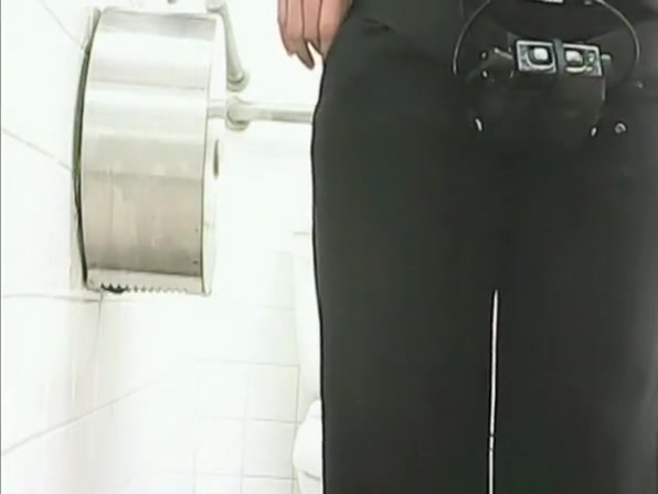 Woman pissing in public toilet