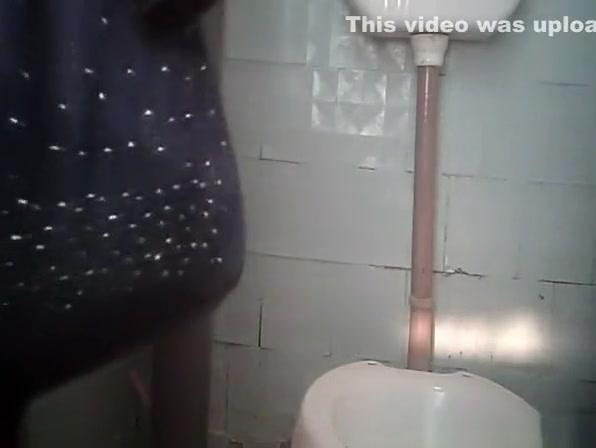 Women in public toilet taking a leak