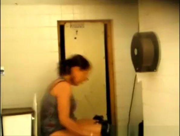 Co-worker pissing and cleaning her pussy
