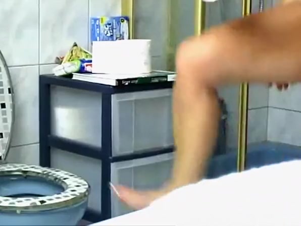 Mature woman spied in bathroom pissing and showering