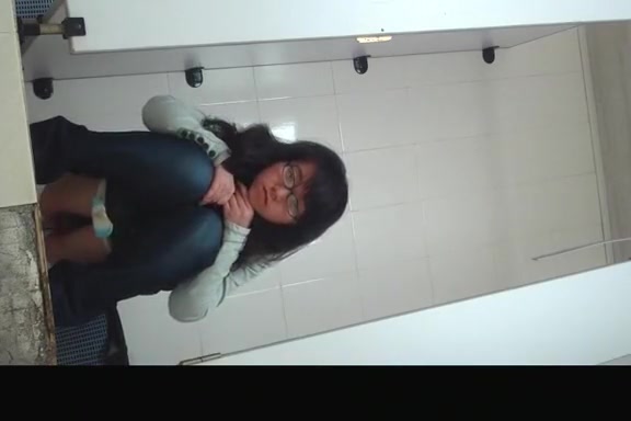 Japanese woman in glasses caught pissing