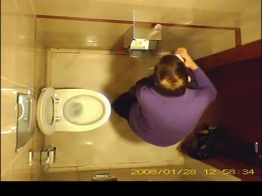 Short hair mature woman taking a pee