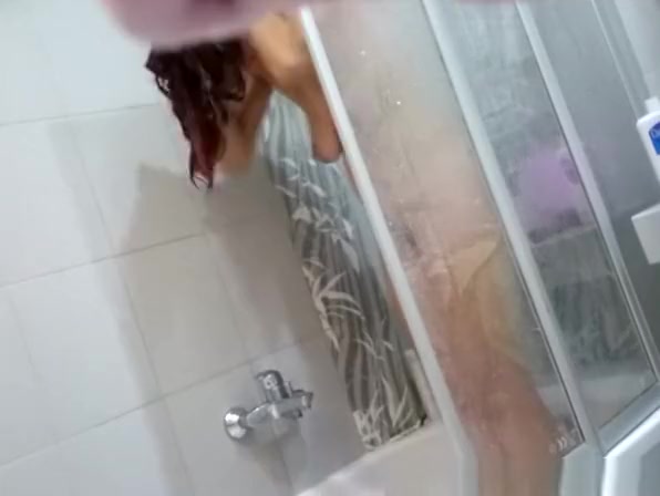 Woman spied in the bathroom shaving her legs