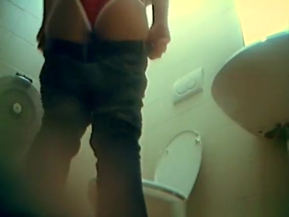 Woman pulls her pants and panties down and pees