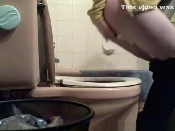 Girl lifts toilet seat and seats to take a pee