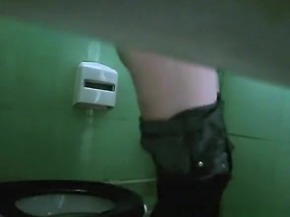 Woman pulling down her pants and pee