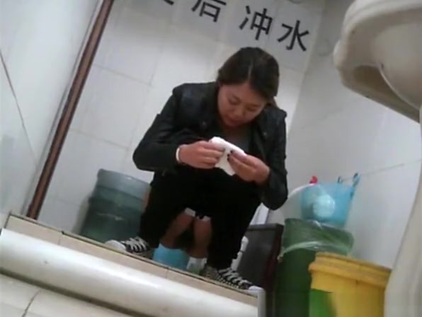 Asian girl in tight jeans pants peeing