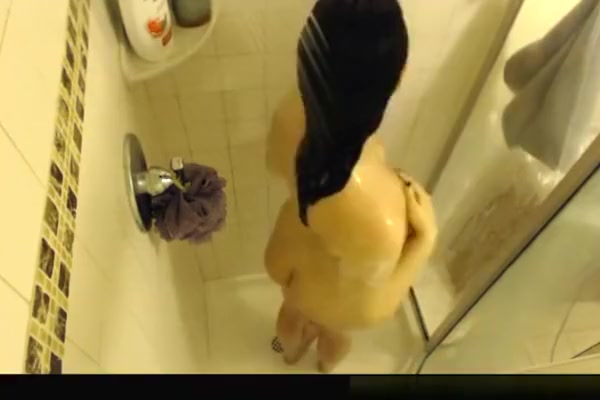 Busty brunette chick showering