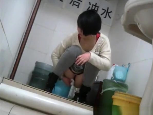 Short hair asian peeing in public toilet