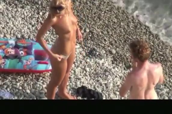 Hot blonde nudist woman swimming