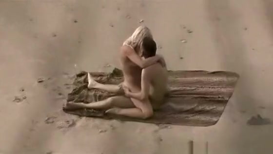 lone couple has sex on public beach