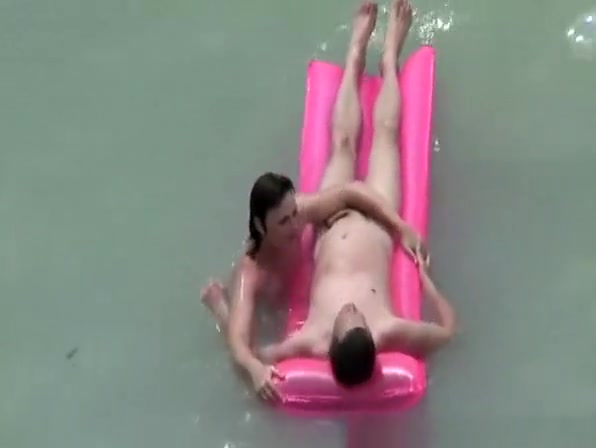 Small boobs nudist swimming in the water
