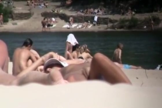 Brunette nudist woman sunbathing