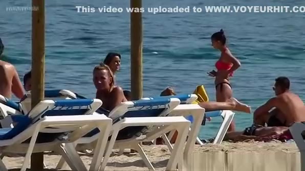 Pretty topless girls sunbathing on the beach