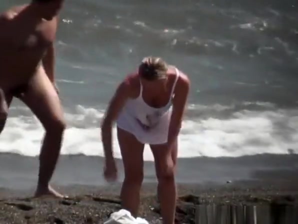 Nudist blonde woman caught in nudist beach