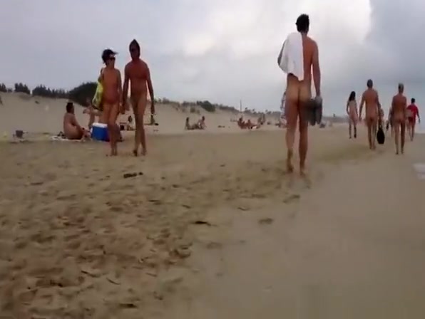Nudist voyeur walking on the nudist beach