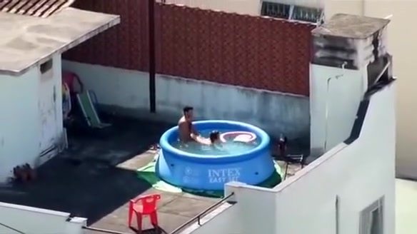 Man and woman fucking in the pool
