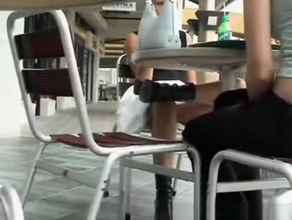 White panties upskirted under table