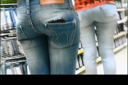 Chicks in tight jeans pants at supermarket