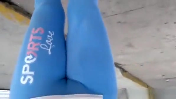 Woman in tight blue sports pants big cameltoe