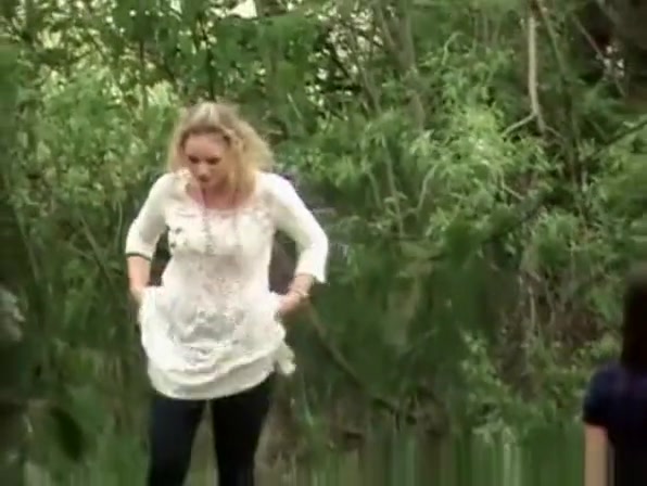 Blonde pees outdoor in nature