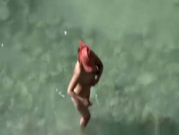 Busty nudist fucked at the beach