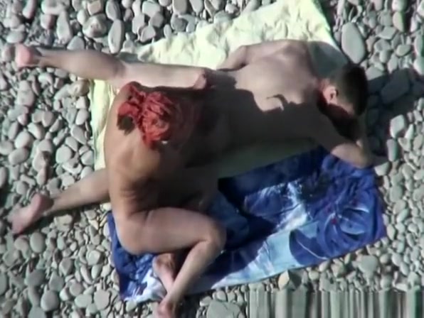Busty nudist fucked at the beach