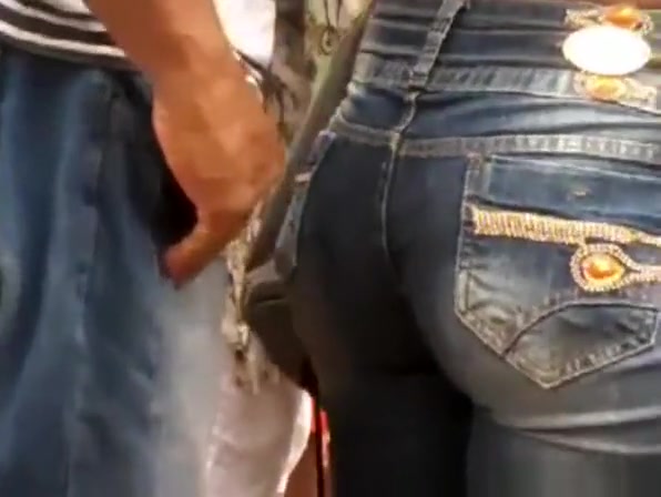 Man touches woman in tight jeans
