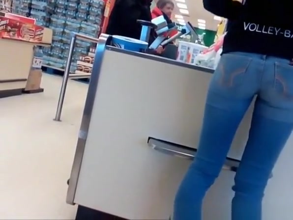 Girl in tight jeans pants at the supermarket