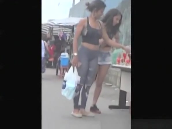 Nice asses on two chicks in the street