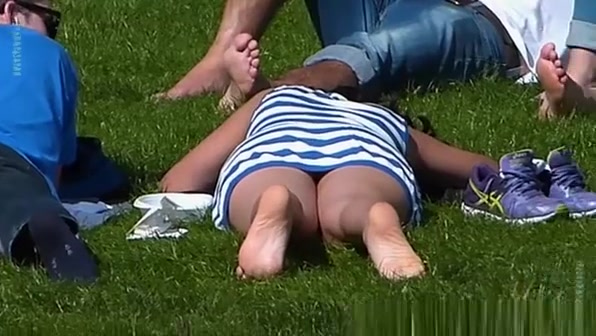 Look under the skirt of a girl lying on the grass