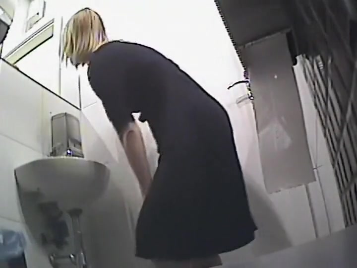 Odd bent over pissing position