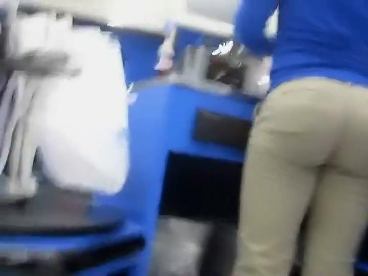 Hot butt of a cash register lady is filmed