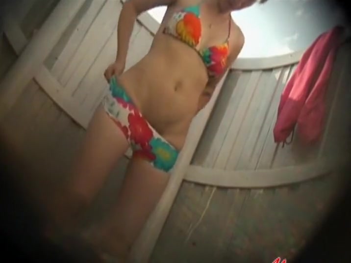 Shaved pussy under a colorful bikini