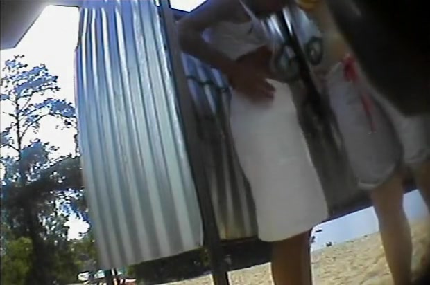 Teenage girl puts a skirt on