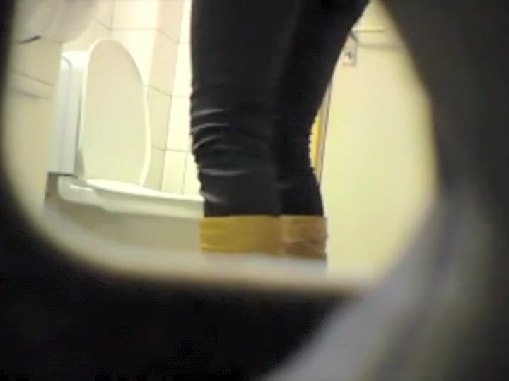 Peeping her through a public toilet hole