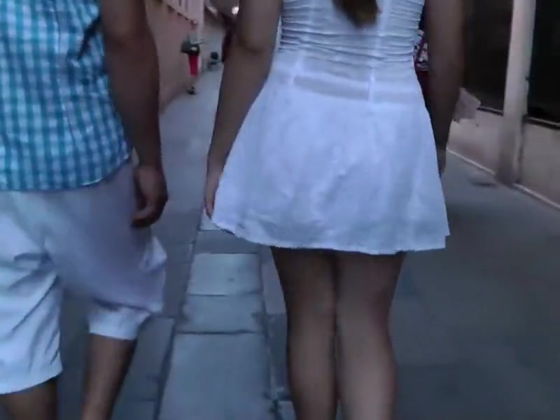 Upskirt of a girl holding hands with a guy